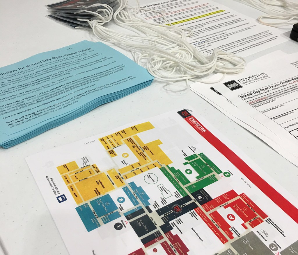 Closeup of color maps and school tour handouts.